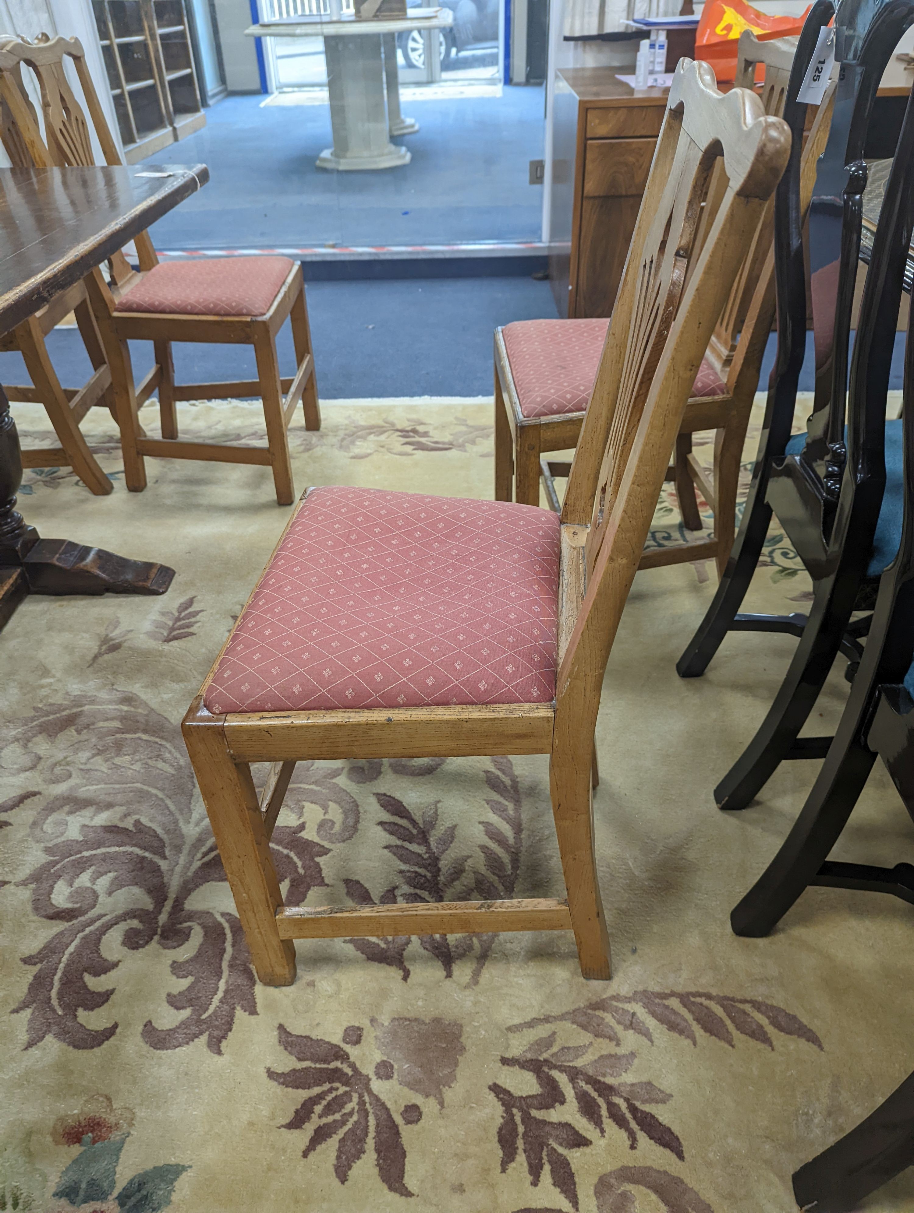 A harlequin set of eight George III provincial oak and elm dining chairs. H-96cm.
